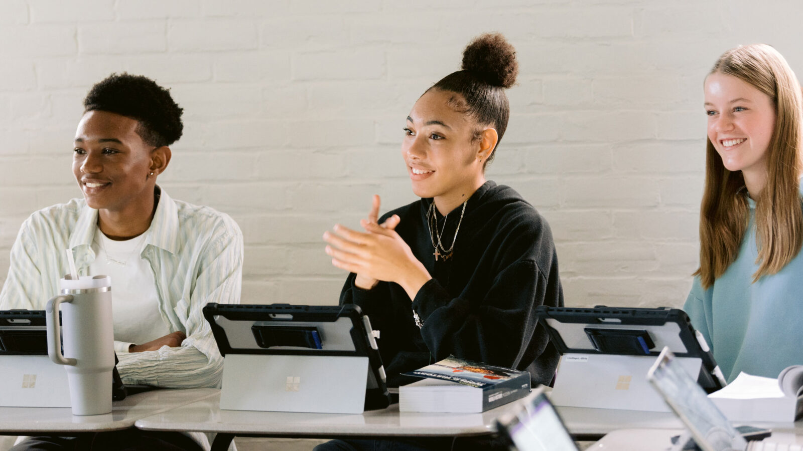 3 students with computers