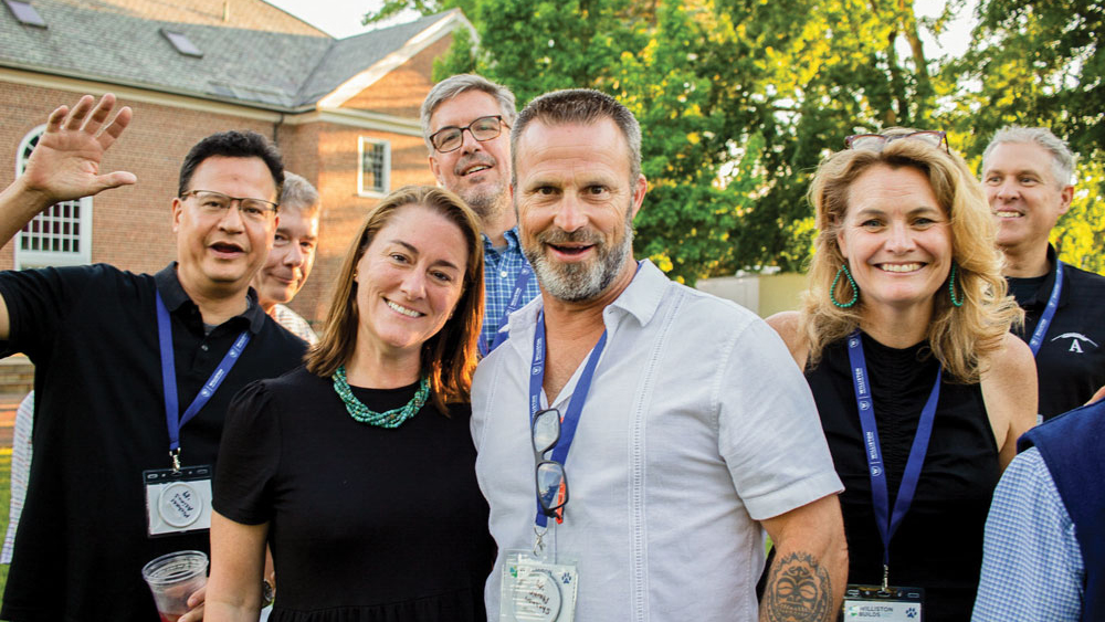 people posing on lawn