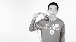 student holding scientific device