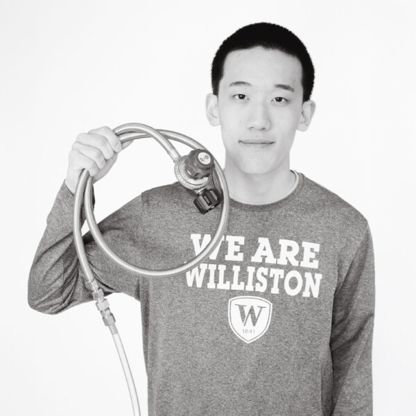 student holding scientific device