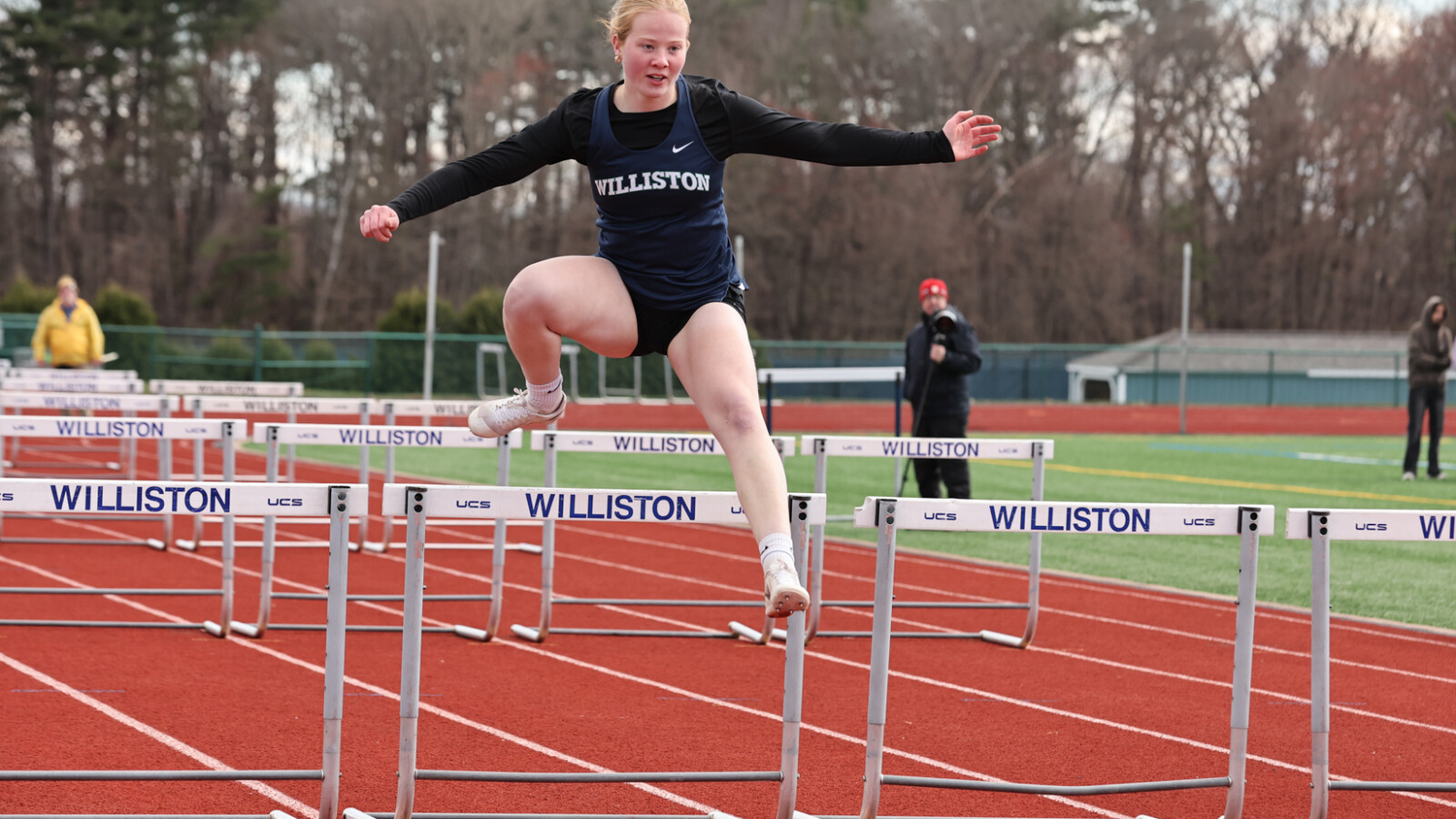 athlete jumping on track