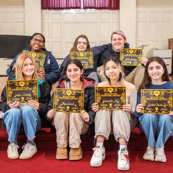 students on stairs posing with certificates