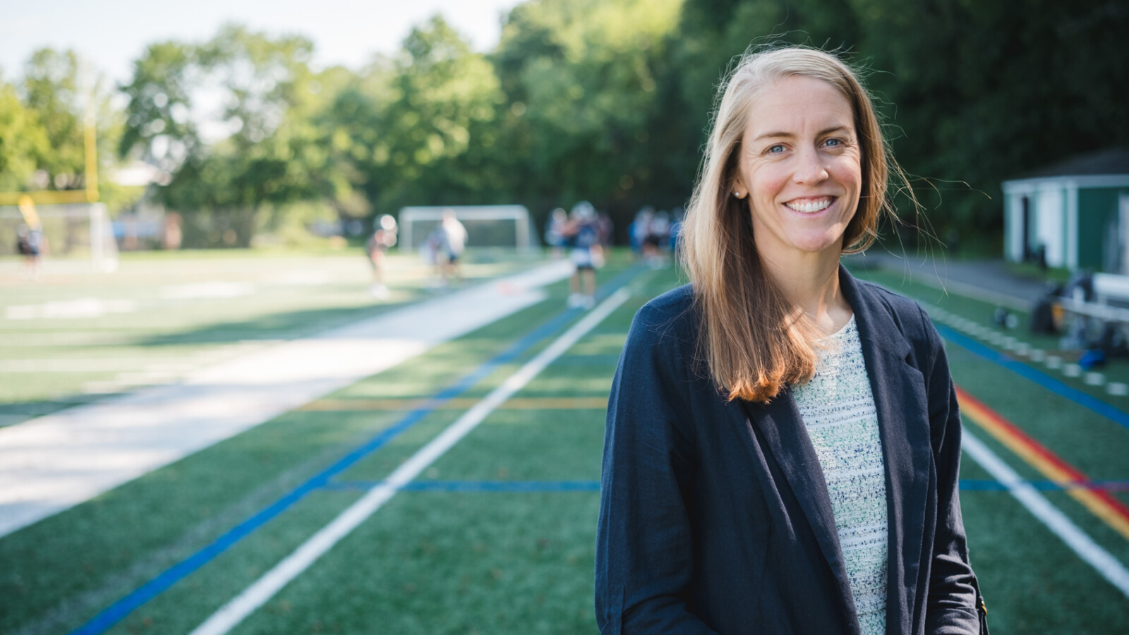 woman standing on athletic field