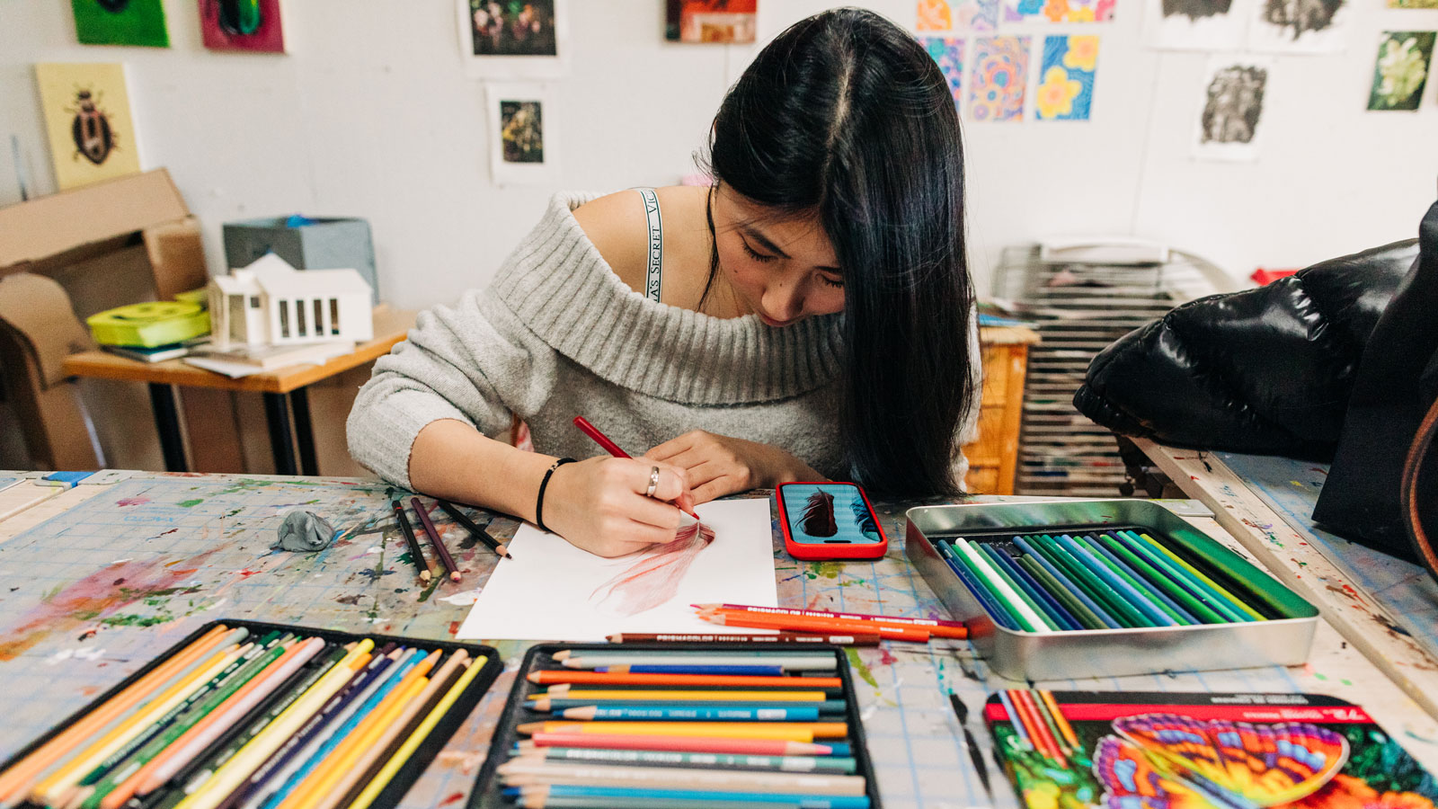 lindseytopham-3281-studio-art-web student artist using colored pencils in classroom