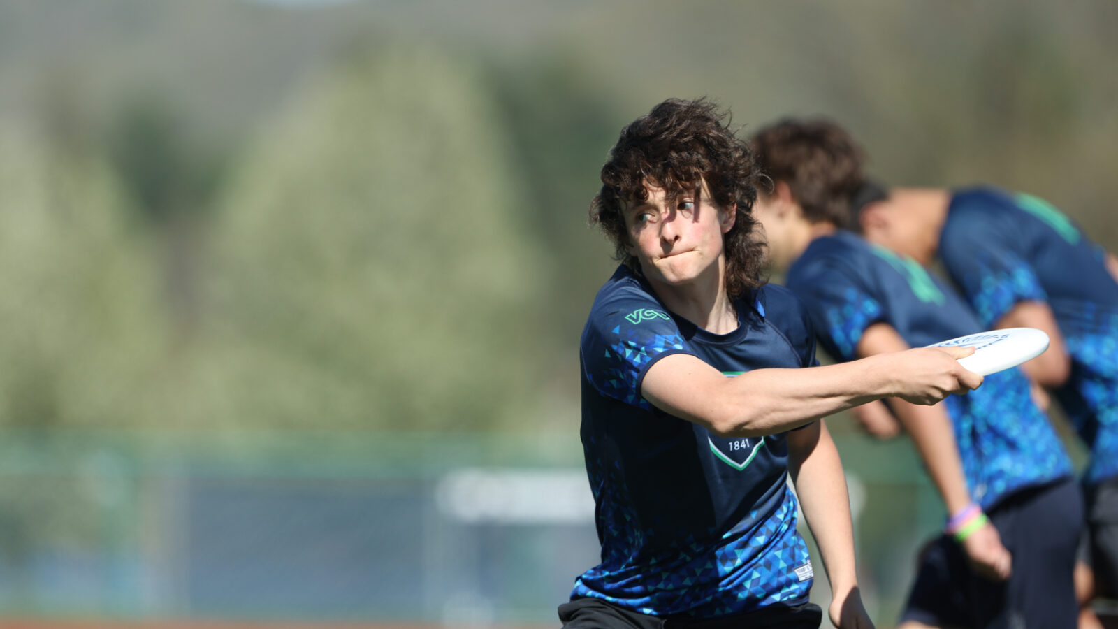 student athlete about to throw a frisbee