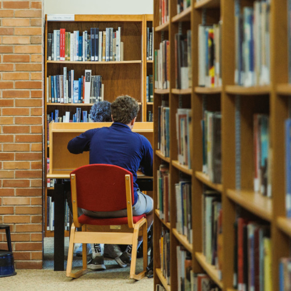 student amid stacks