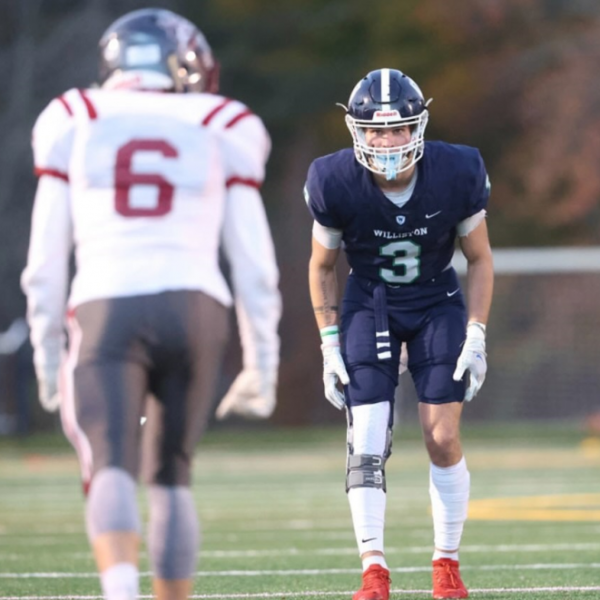 football player facing off with opposition